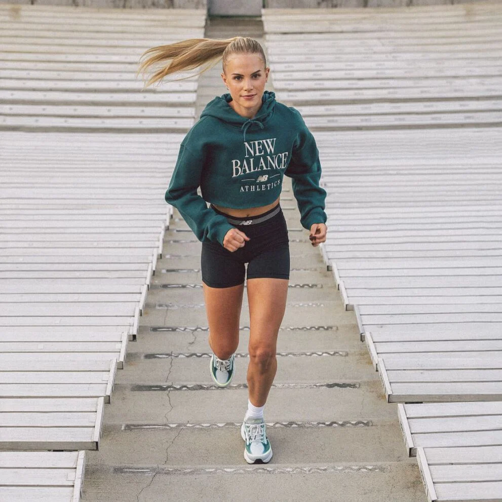 Parker Valby running up bleacher stairs  